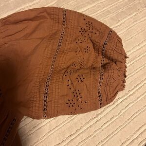 Free people in new condition boho button top with embroidered details.